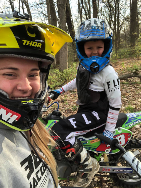 Nicole and her son riding dirt bikes