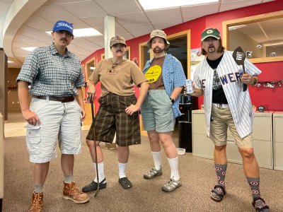 Tingalls staff dressed up as dads for Halloween.
